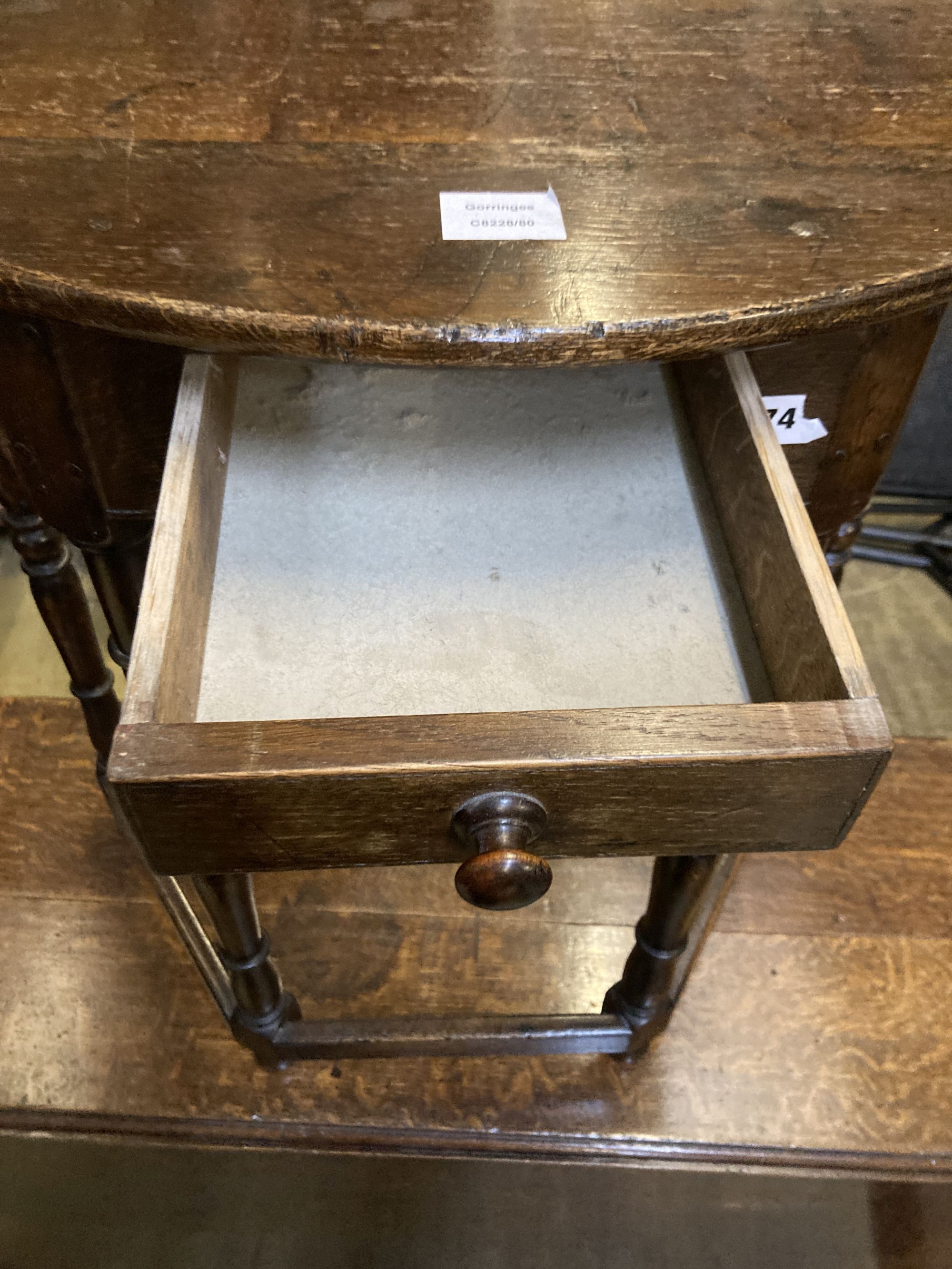 A 18th century style D shaped oak side table, width 68cm, depth 35cm, height 76cm